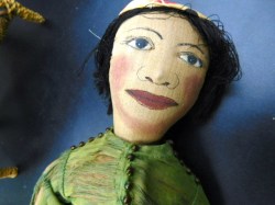 2 ethnic silk cloth dolls face a